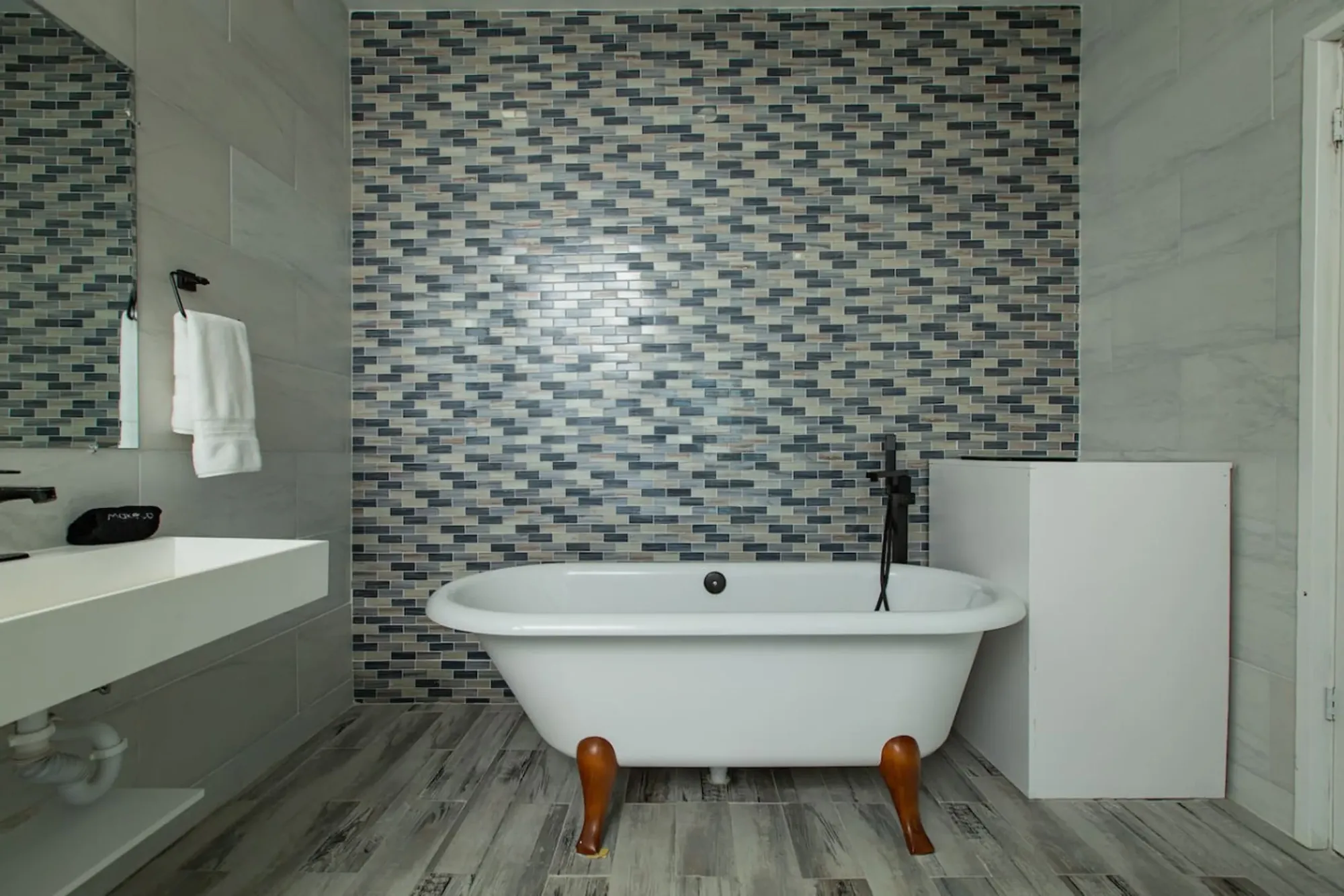 A bathroom with a freestanding tub