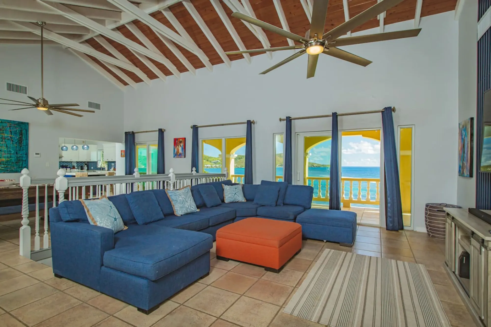 The great room with a vaulted wood-beam ceiling