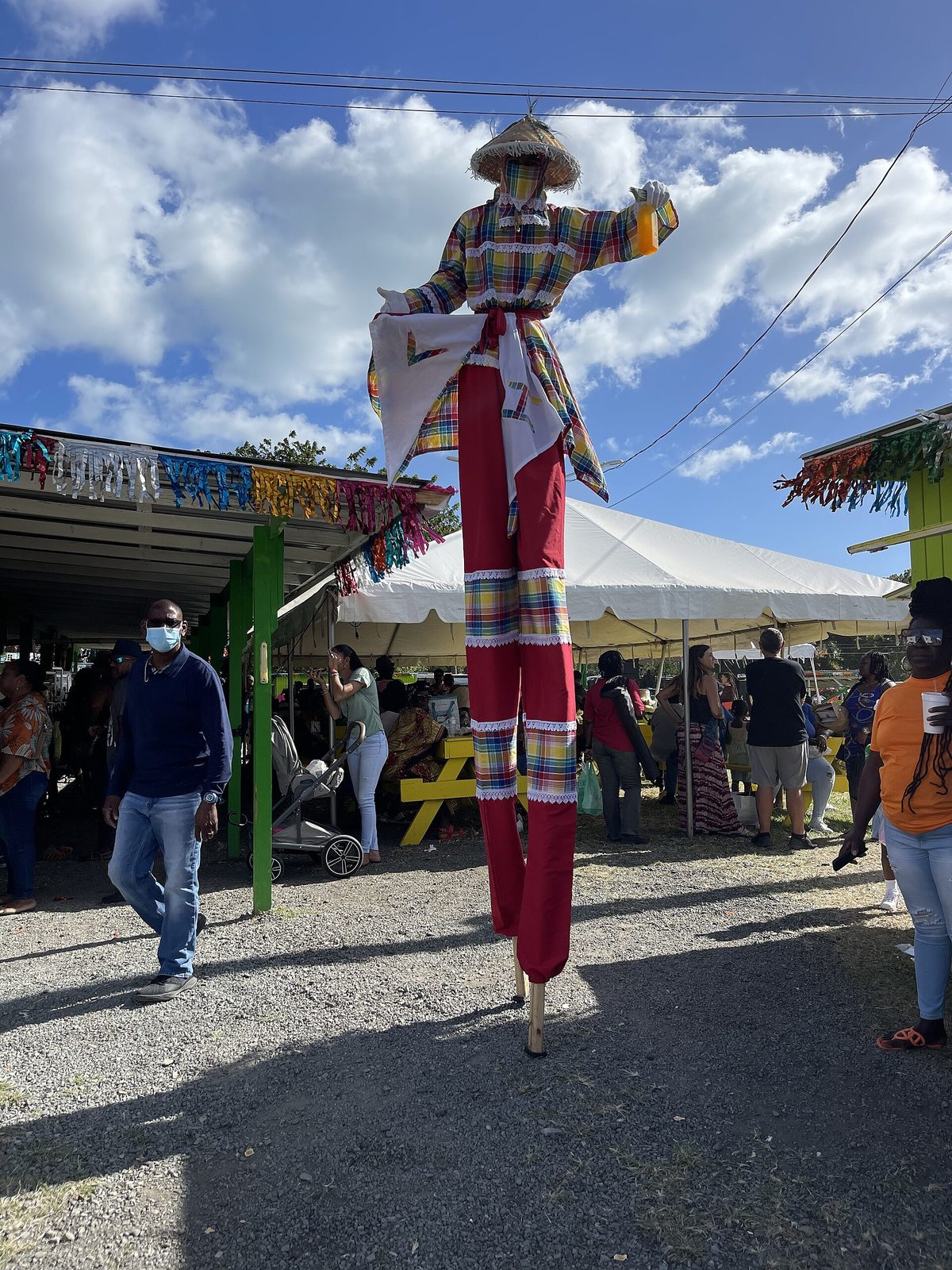 Mocko Jumbie stops by Savor St. Croix for a cold passion fruit juice at Agrifest 2023